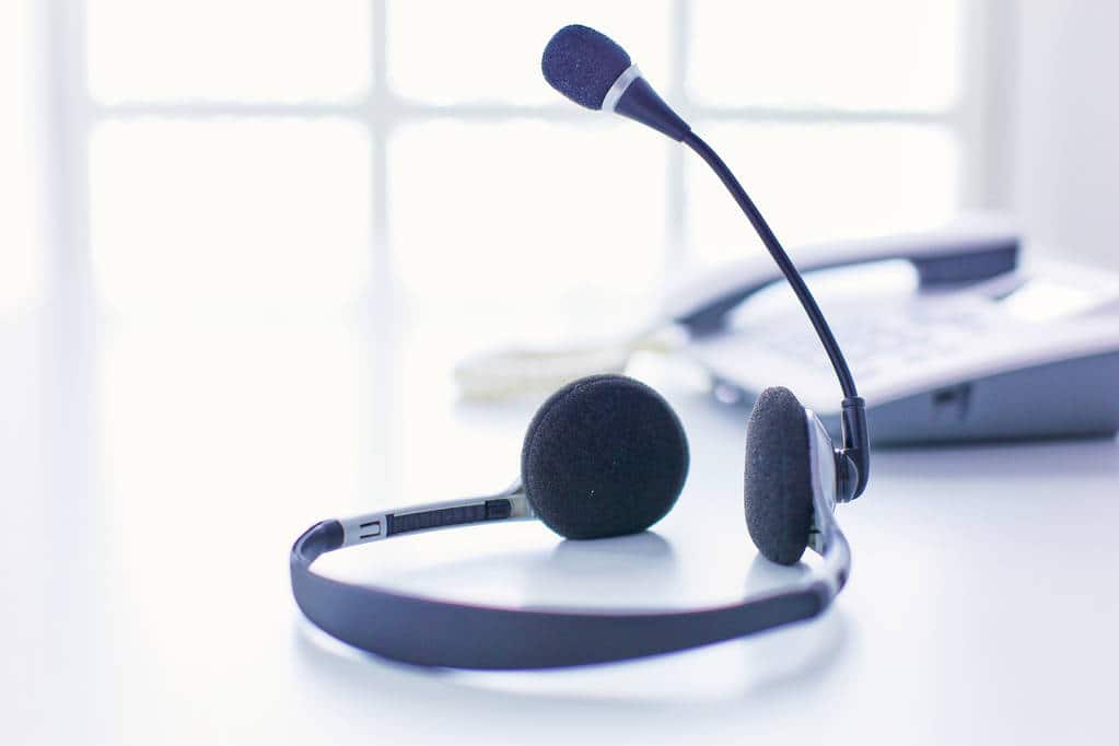 A phone and a headset in a call centre operation